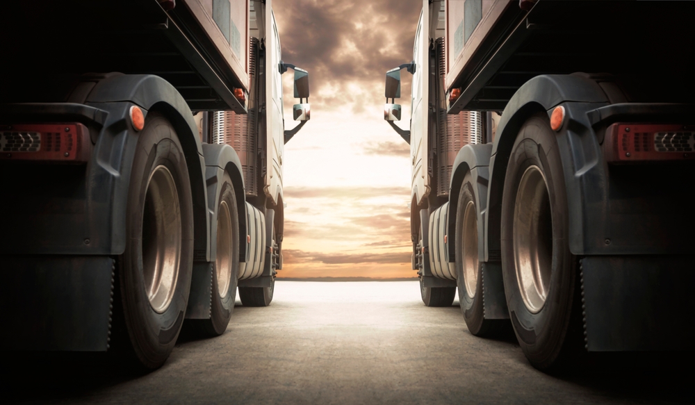 Semi,trailertrucks,on,parking,with,the,sunset,sky.,shipping,container