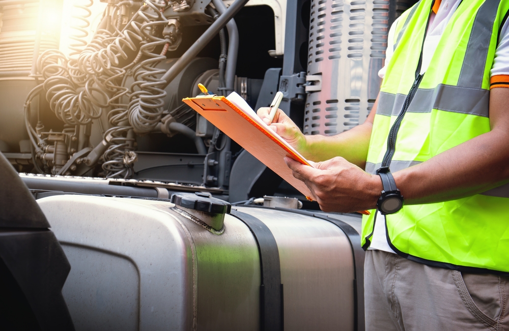 Truck,drivers,checking,the,semi,truck's,fuel,tank.,mechanic,repairman