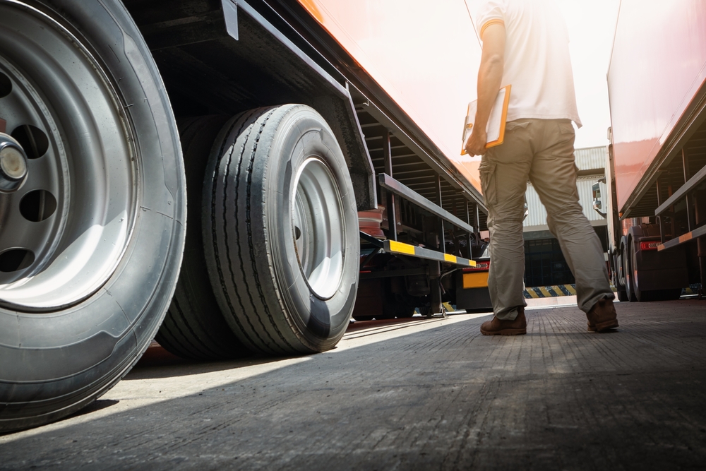 Trailer,truck,on,the,parking,lot.,truck,drivers,holding,clipboard