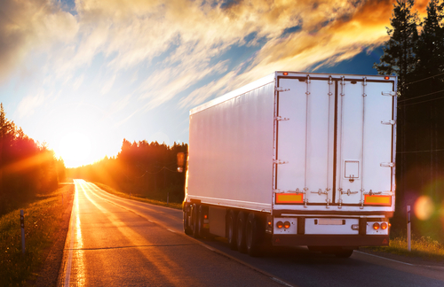 White,truck,on,the,asphalt,rural,road,in,the,polar
